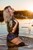 woman fully clothed wet hair shirt denim shorts stockings shoes high heels lake