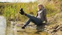 blonde wet girl swim fully clohed wet hair blouse skinny jeans jacket high heels lake