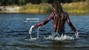 wet girl long haired swim fully clothed water wet clothes jeans shirt tights shoes wet hair lake