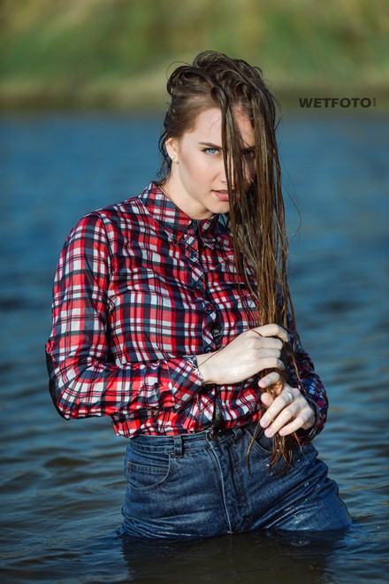 wetlook long haired girl swims posing water wet clothes on high waisted jeans shirt pantyhose wetfoto