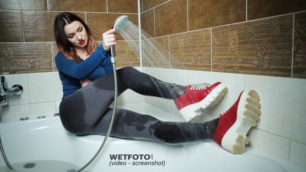 wet girl get wet photo soaking fully clothed bathroom sweater leggings tights shoes