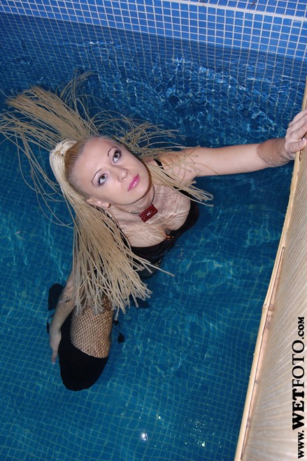 wet girl get wet wet hair fully clothed bustier denim shorts fishnet stockings jackboots high heels jacuzzi
