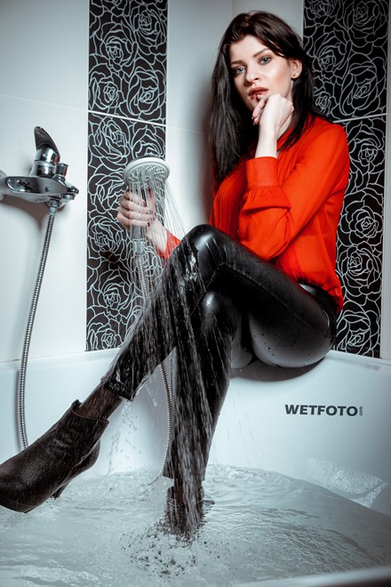 wetlook girl get wet fully clothed bathroom takes shower shiny faux leather pants