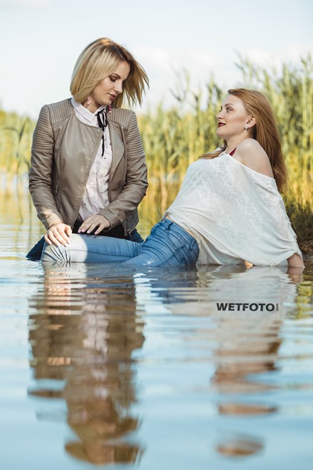 wet girl fully clothed blouse jacket jeans tights water lake