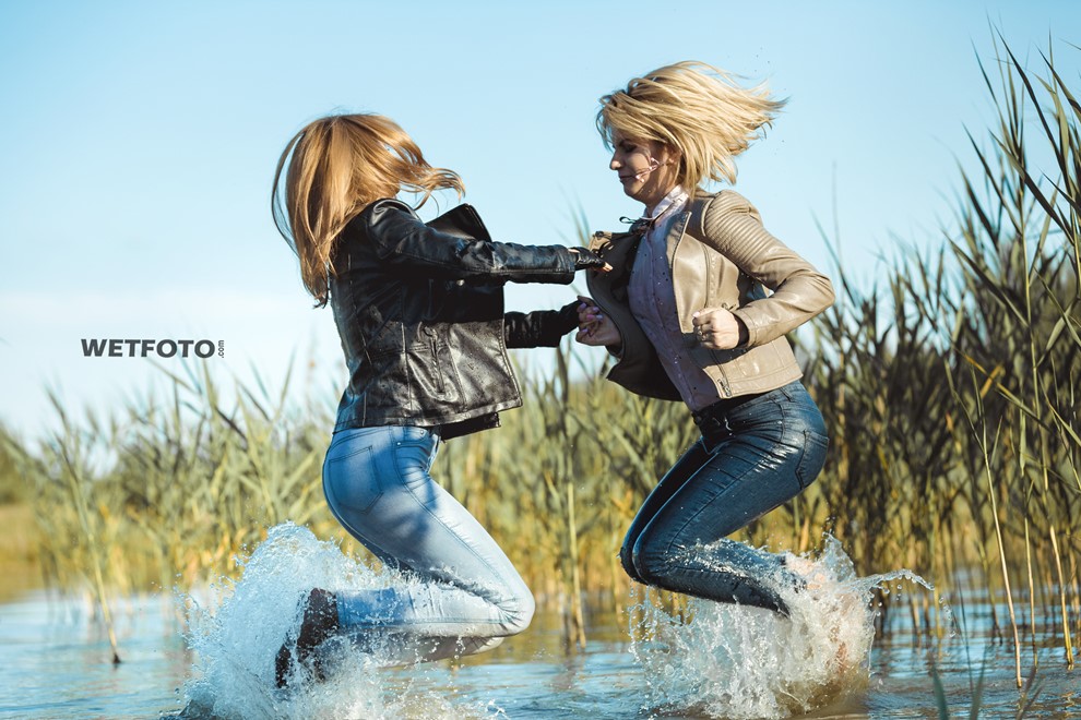 wet girl fully clothed blouse jacket jeans tights water lake