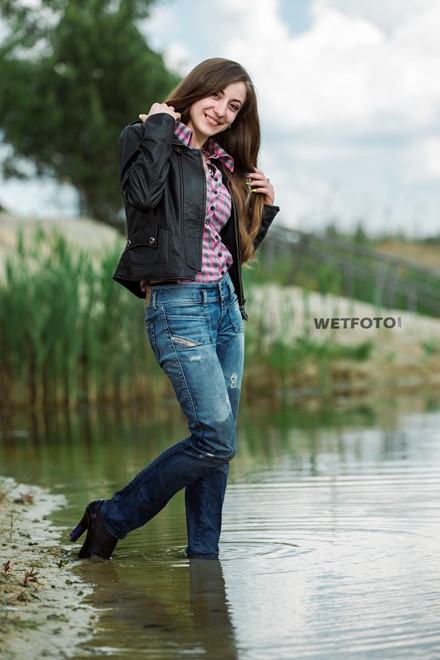 wet girl get wet jacket jeans leather shirt shoes high heels tights fully clothed water swim lake
