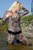wet girl get wet wet hair fully clothed jumpsuit leather boots heels belt lake