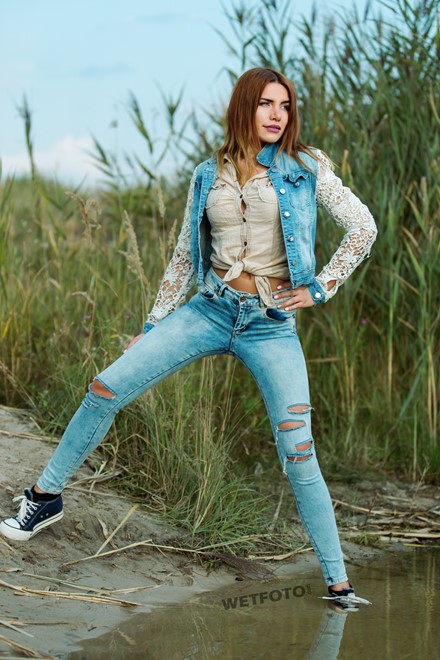 wet girl get wet jacket skinny jeans socks sneakers wet hair lake