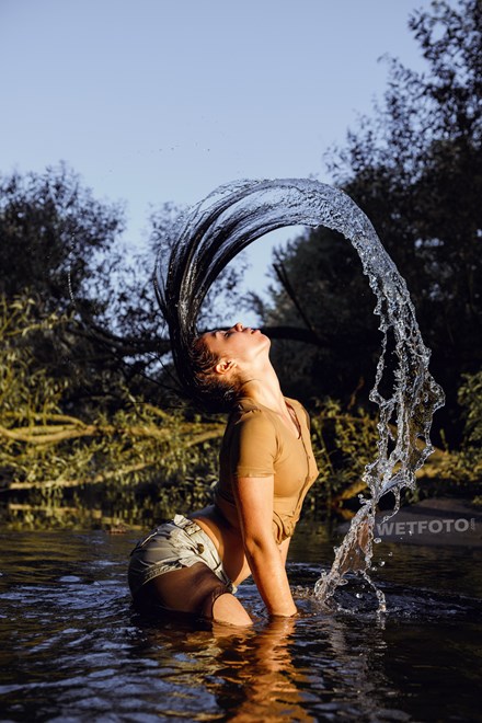 wetfoto wetlook flexible fully clothed girl dancing water
