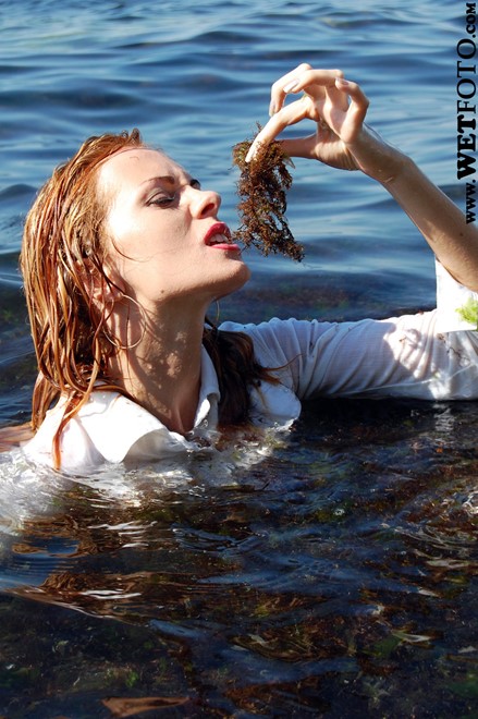wet girl get wet wet hair fully clothed jacket jeans top baseball cap shoes sea