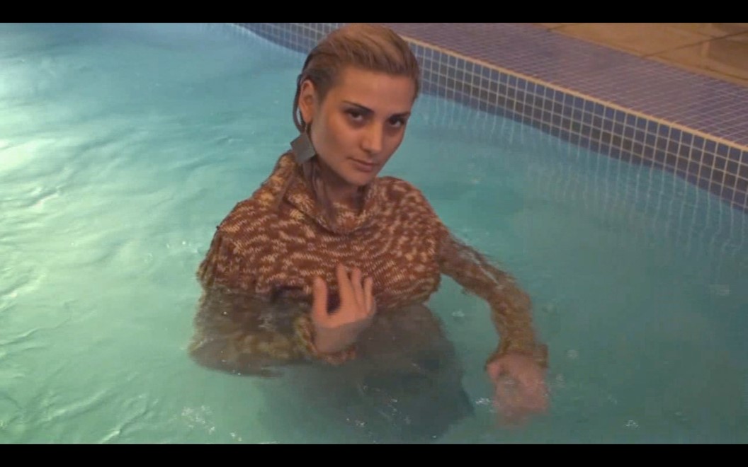 wet girl get wet wet hair fully clothed fur coat sweater jeans hat leather boots jacuzzi