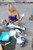 wet girl get wet fully clothed top denim shorts stockings boots leather