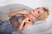 wetfoto blonde girl makes skinny jeans completely wet bath