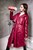 girl wet red leather coat rubber boots in a milk bath wetfoto