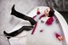 girl wet red leather coat rubber boots in a milk bath wetfoto