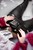 girl wet red leather coat rubber boots in a milk bath wetfoto