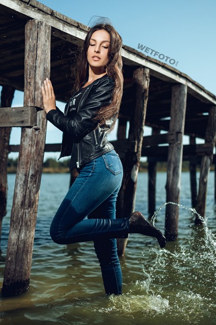 wetfoto completely wet fullydressed brunette walks on water