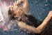 wetfoto woman swims pool fully clothed winter coat