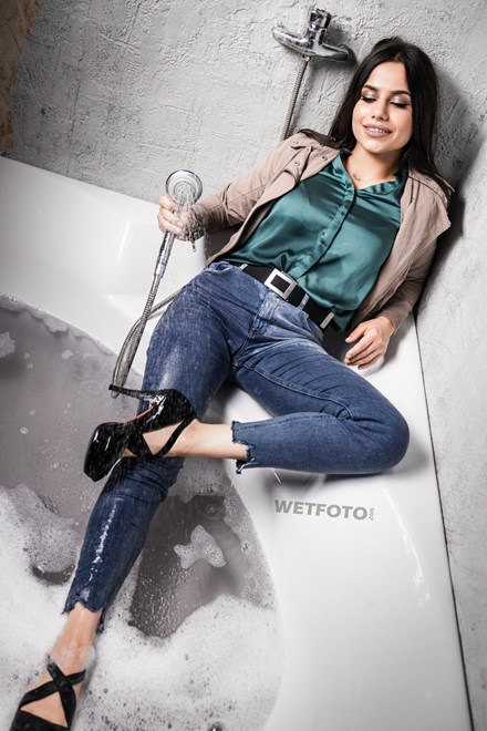 hot girl takes bath jeans shirt wetfoto wetlook