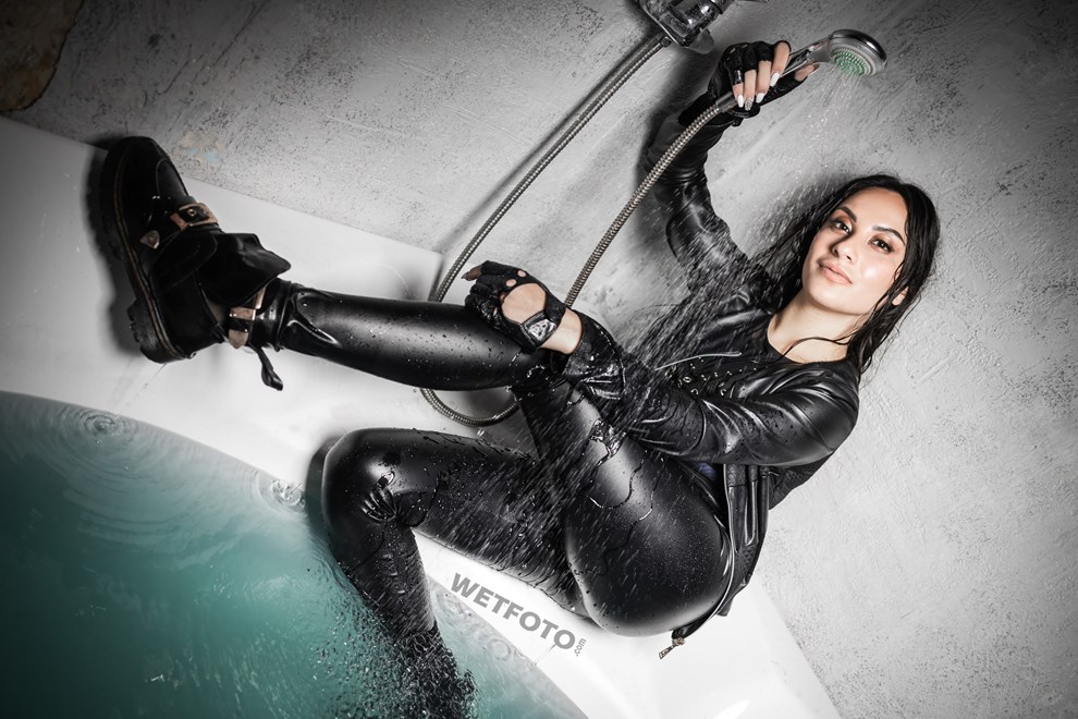 fully clothed girl gets completely wet bath shiny leggings