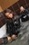 wet girl get wet wet hair fully clothed jacket leather dress stockings high heels bath
