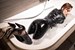 wetfoto wetlook woman gets wet vinyl pants bathrom