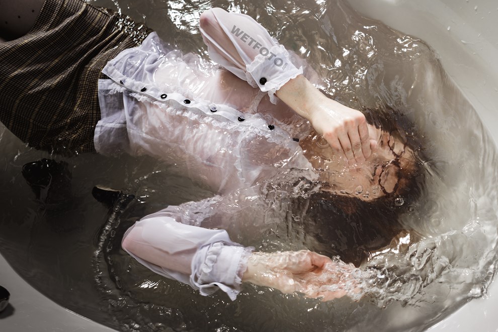 wetfoto girl business attire nylons skirt takes bath shampoos hair
