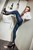 wetfoto fully dressed girl skinny jeans swims in the pool