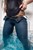 wetfoto fully dressed girl skinny jeans swims in the pool
