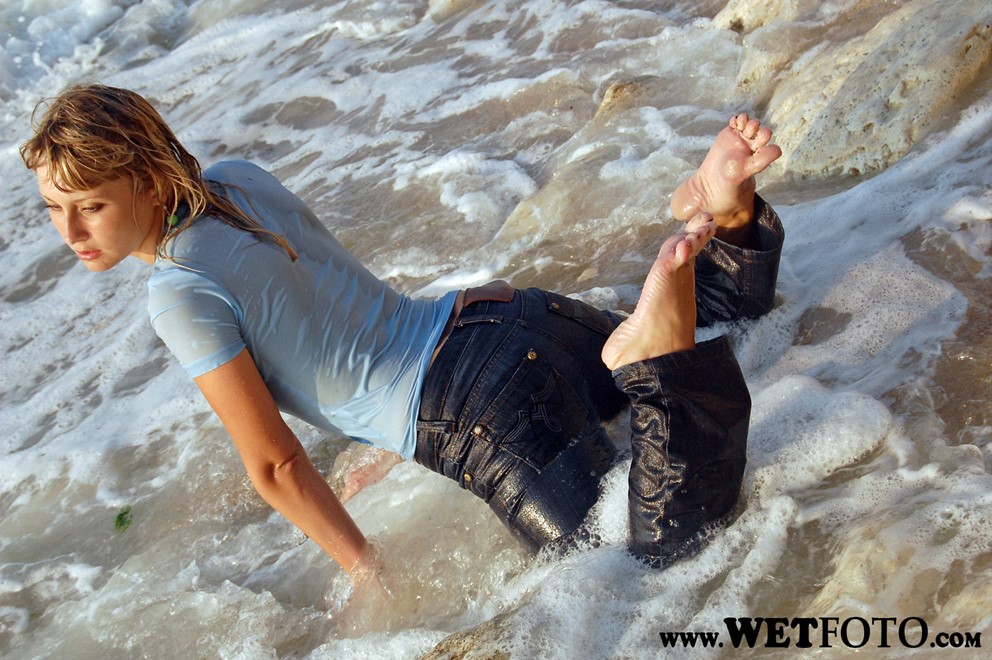 wet girl get wet wet hair fully clothed t-shirt jeans sea