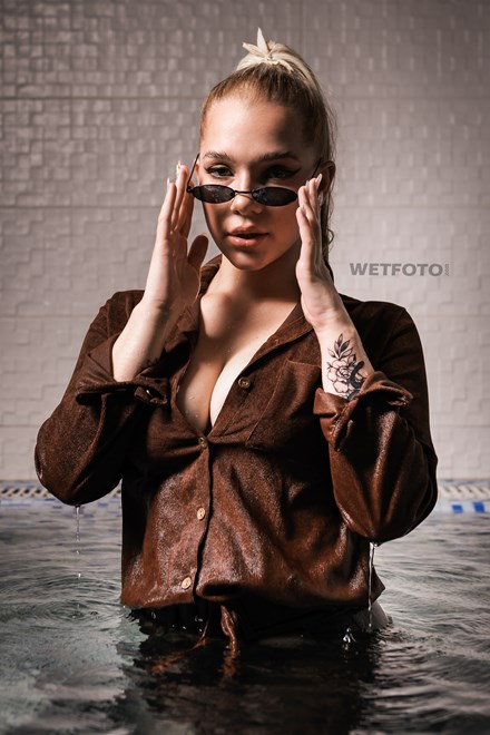 wetfoto blonde girl tight pants shoes corduroy shirt get wet pool