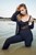 girl swims in lake business suit nylons