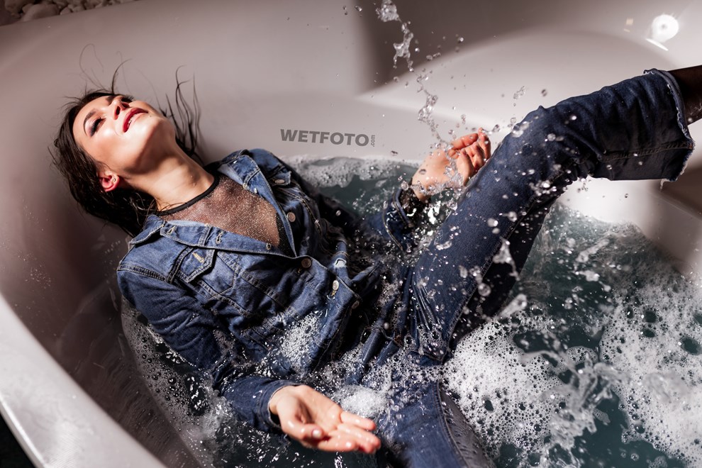 woman denim outfit nylons takes bath wetfoto