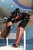 wet girl get wet fully clothed lacquer jacket fishnet tights high-heeled sandals wet hair spa