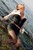 wet woman get wet wet hair fully clothed blouse skirt stockings high heels sea