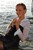 wet woman get wet wet hair fully clothed blouse skirt stockings high heels sea