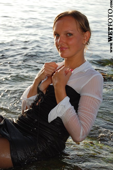 wet woman get wet wet hair fully clothed blouse skirt stockings high heels sea