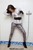 wet girl get wet wet hair fully clothed shirt leggings leather gloves belt socks high heels shoes pool