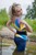 wet girl get wet fully clothed blouse leggings leather belt shoes river