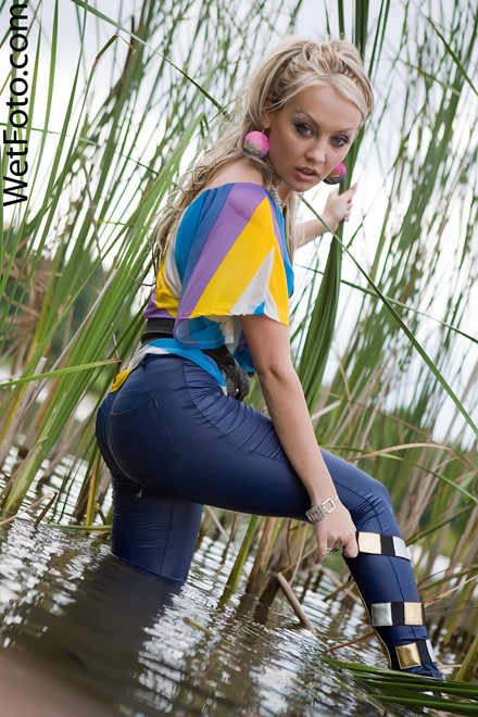 wet girl get wet fully clothed blouse leggings leather belt shoes river