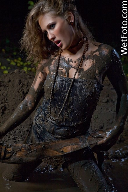 wet girl get wet fully clothed vest fur t-shirt jeans socks mud