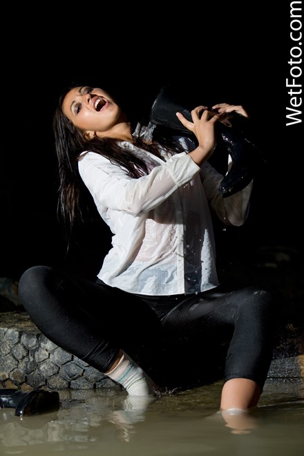 wet girl get wet wet hair fully clothed leggings shirt vest leather boots lake