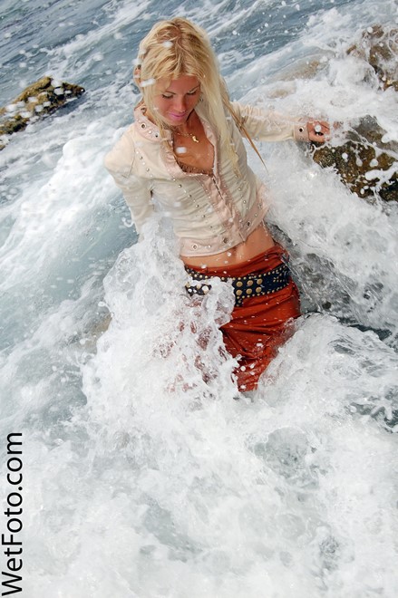 wet girl get wet wet hair fully clothed jacket skirt stockings shoes top sea
